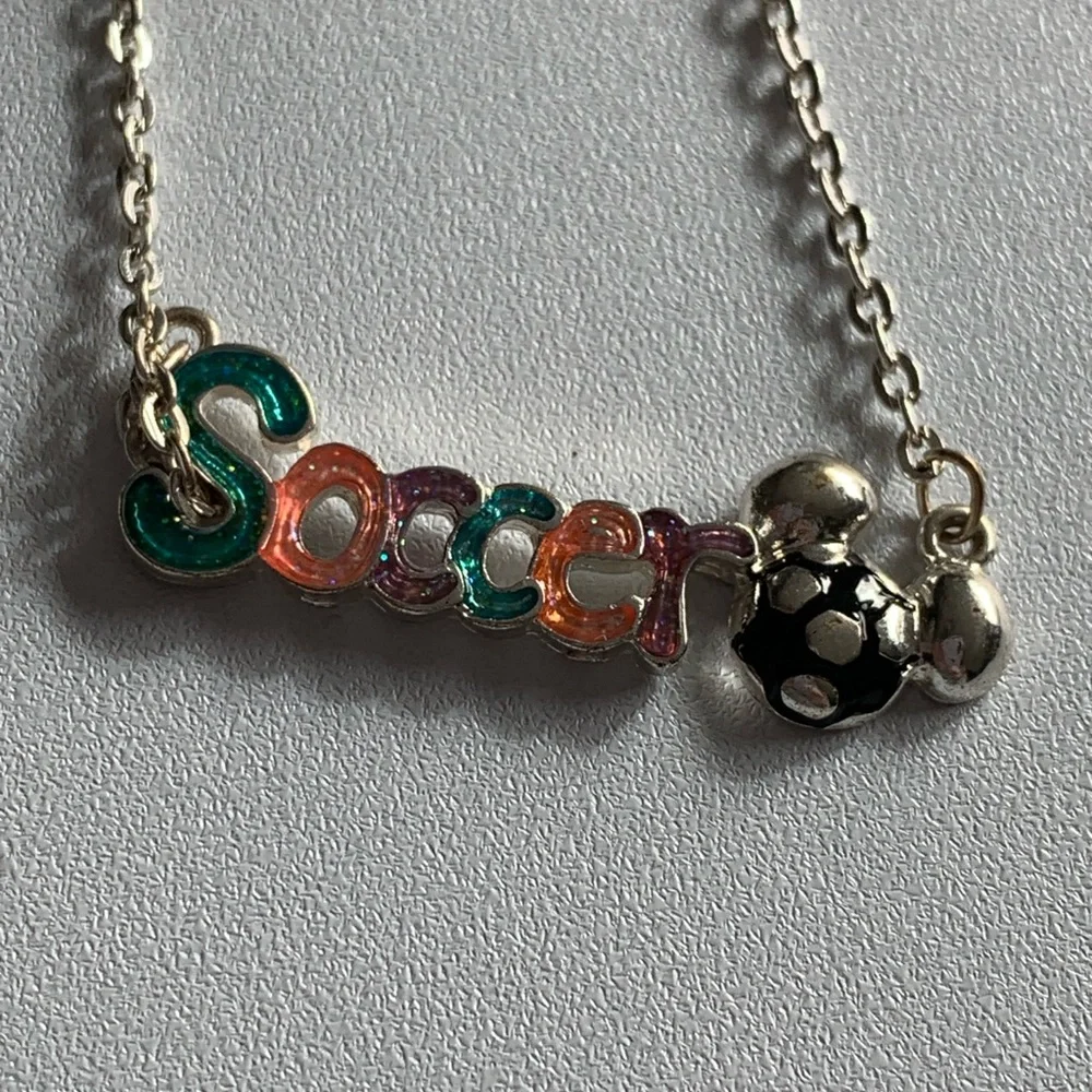 Disney girls soccer necklace.